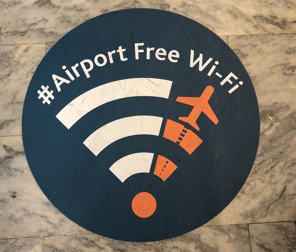 Wi fi sign on floor of airport terminal
